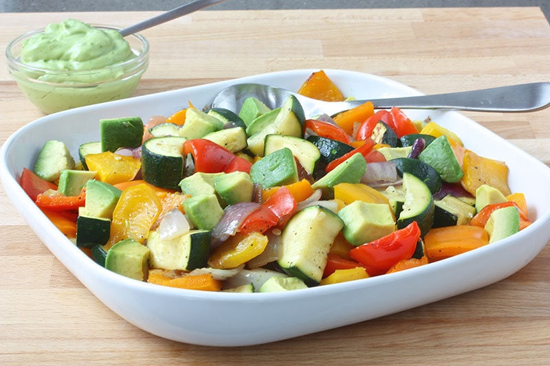 Plate of grilled vegetables with avocado