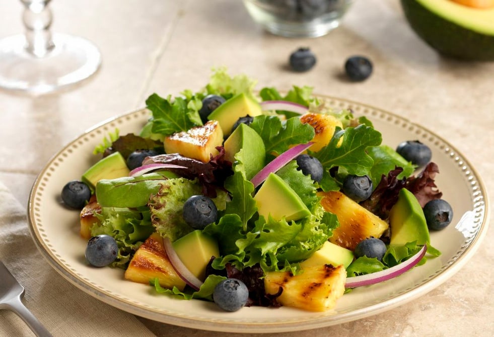 peel avocado and dice in salad